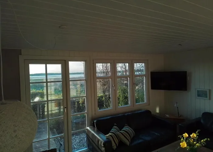 One-of-a-kind Waterfront Wooden House Ferienhaus Hejls